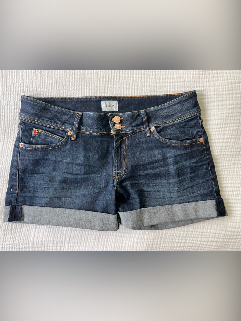 HUDSON JEANS Croxley Dark Blue Cuffed Denim Shorts with signature pocket flaps.